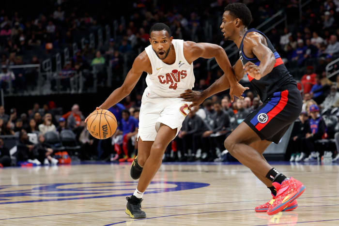 Mar 1, 2024; Detroit, Michigan, USA; Cleveland Cavaliers forward Evan Mobley (4) dribbles against Detroit Pistons center Jalen Duren (0) in the first half at Little Caesars Arena. Mandatory Credit: Rick Osentoski-USA TODAY Sports